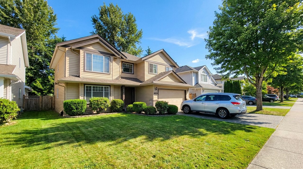 Candid phone photo of a well-kept detached home in Surrey, BC being assessed before listing, for AG. Song REALTOR®