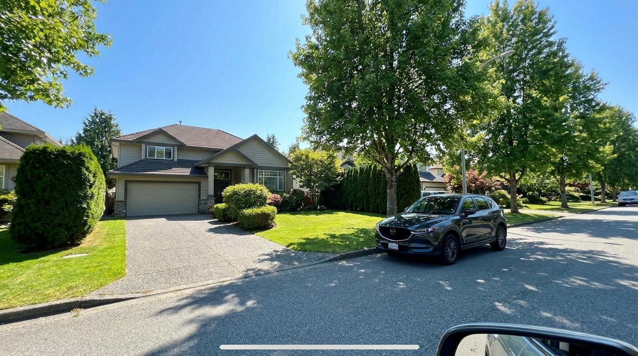 A Surrey home being valued Candid phone photo of a well-kept Surrey, BC home being valued, for AG. Song REALTOR®